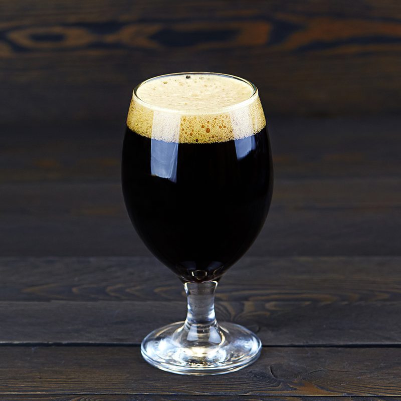 Dark beer in a glass.