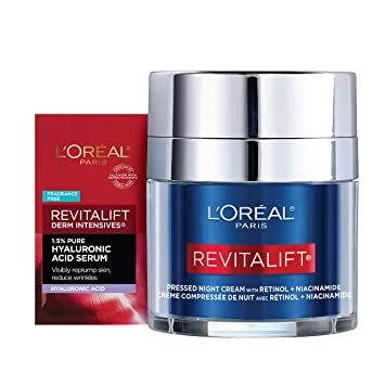 Loreal Paris Revitalift night cream with sample on a white background.