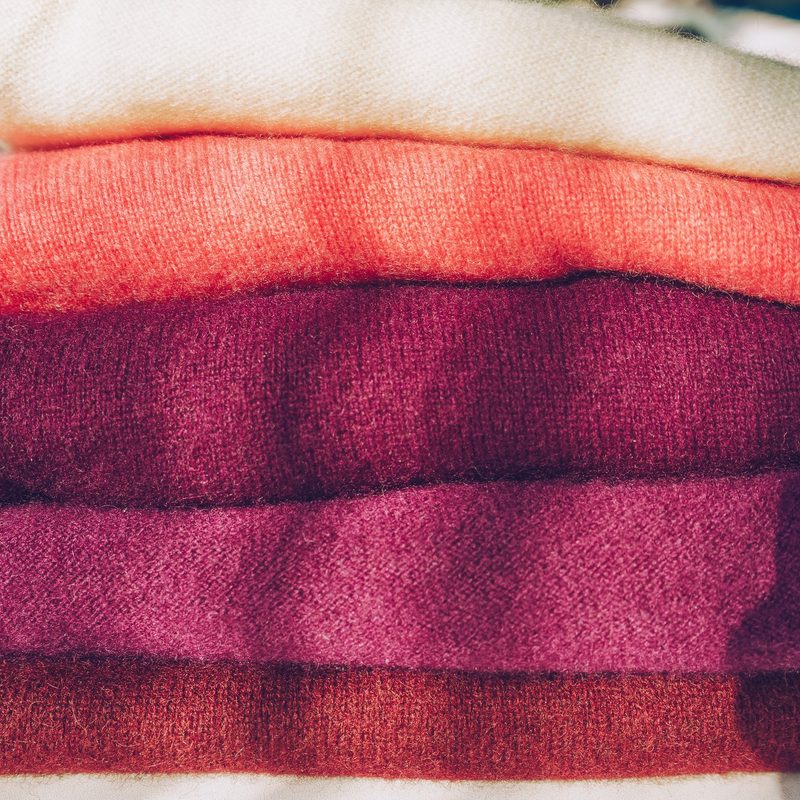 A stack of Merino wool shirts.