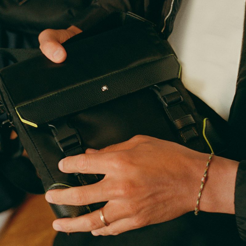 The nylon fabric, webbing straps, and plastic buckles on this Montblanc X PSNY envelope bag are all made from recycled materials.