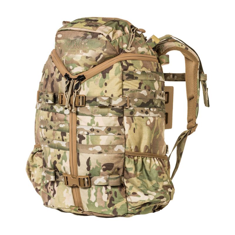 A camouflage Mystery Ranch 3-Day Assault Pack.