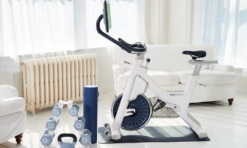 MYX II Plus stationary Star Trac bike with weights in white color.