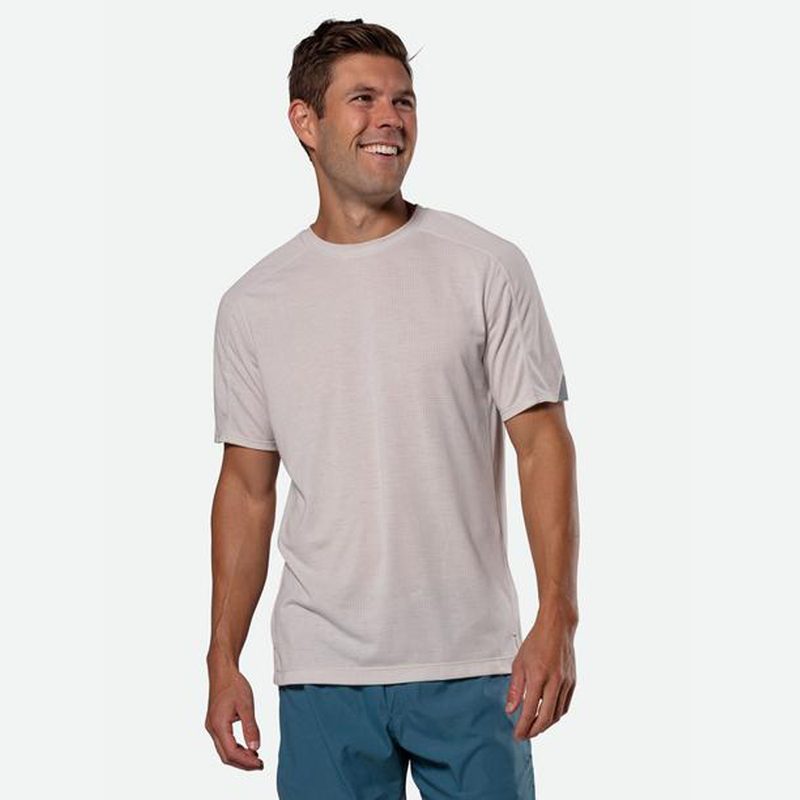 A smiling male model wearing a short-sleeve t-shirt from Nathan.