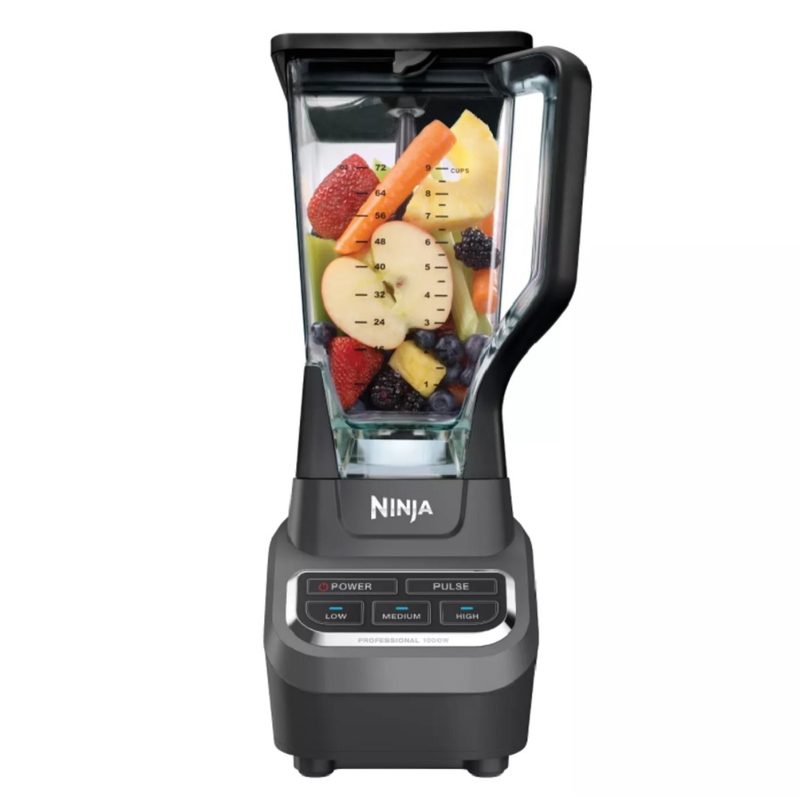 The 1,000-watt Ninja Professional Blender with fruits and vegetables inside.