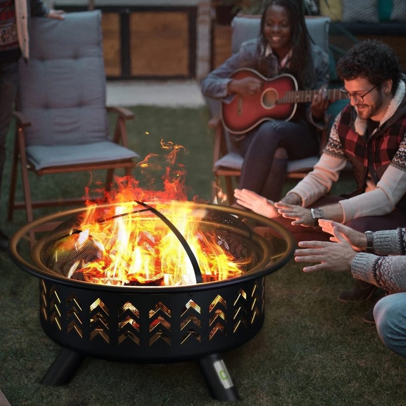 Group of people gathered around a Qomotop Fire Pit.