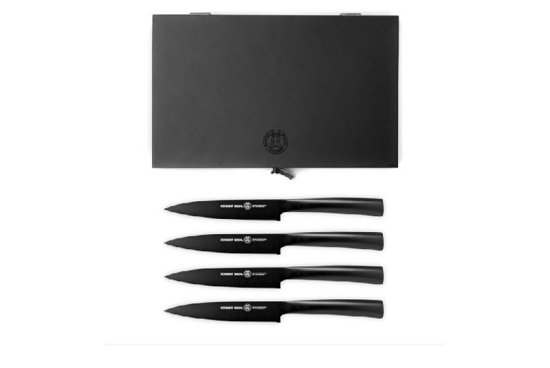 A set of black Schmidt Brothers steak knives.