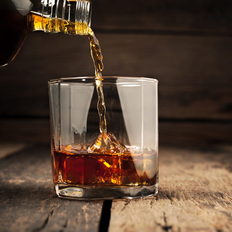 Pouring a glass of whiskey
