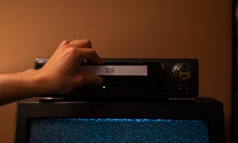 vcr player with static on tv screen.