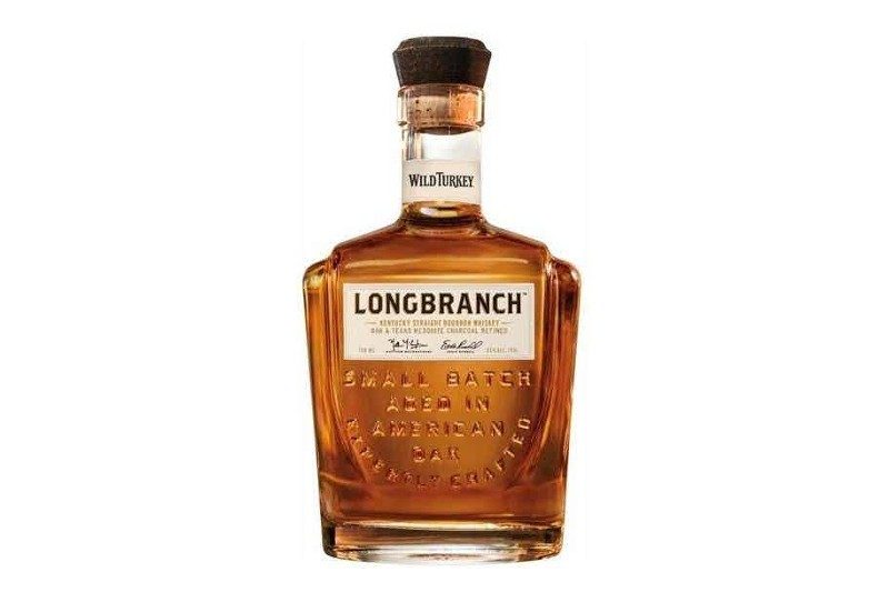 Wild Turkey Longbranch bourbon whiskey with a white background.