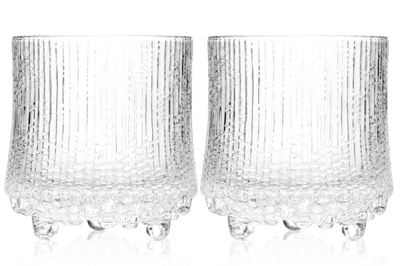 A pair of Finnair Whiskey Glasses sitting side by side.