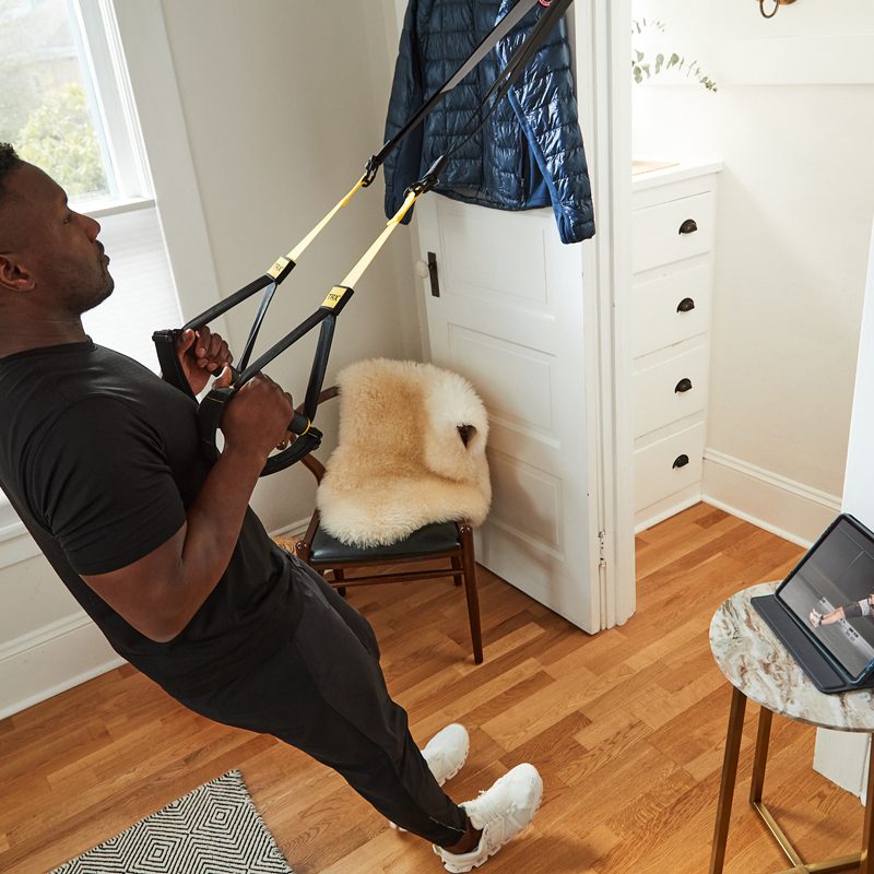 Man doing TRX rows.