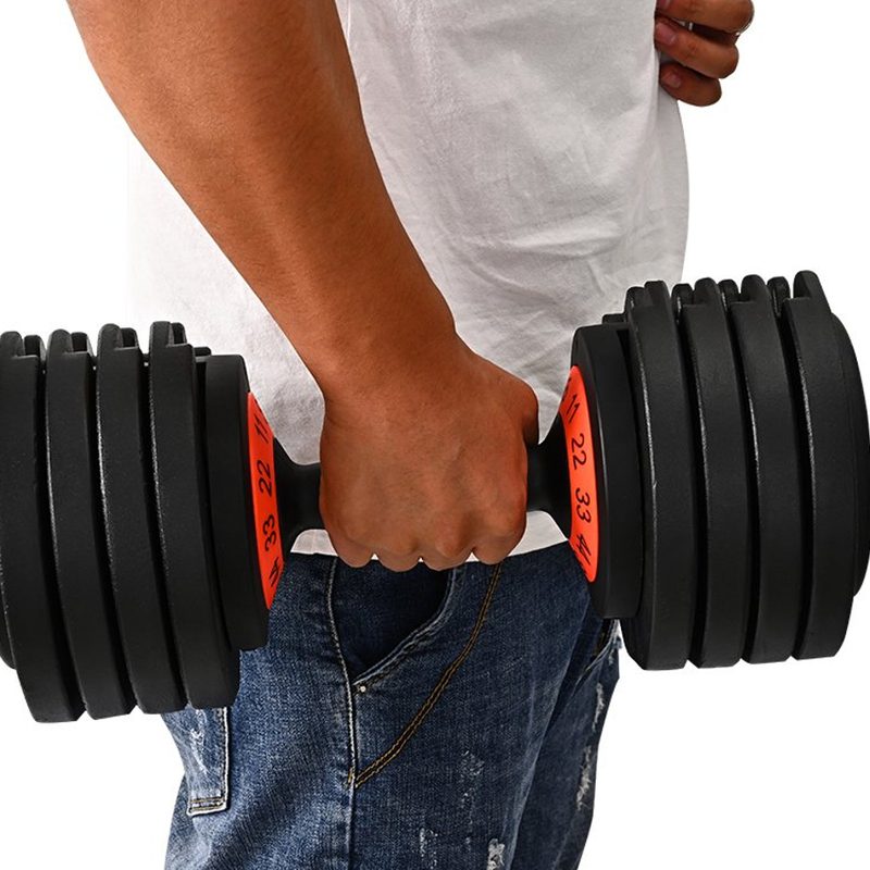 A man holding a Skonyon Adjustable Dumbbell.