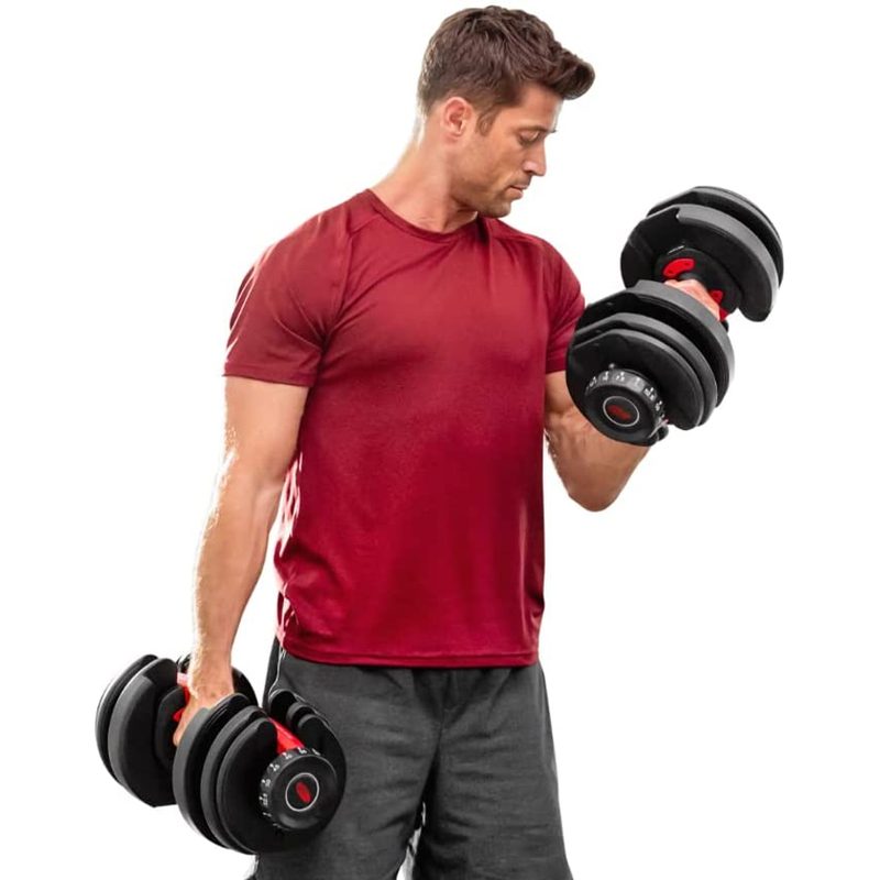 A man does bicep curls using Bowflex SelectTech 552 Adjustable Dumbbells.