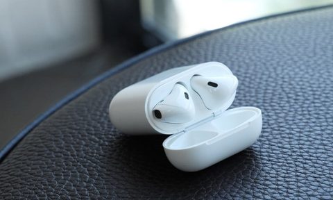 The Apple AirPods 2 in their charging case.