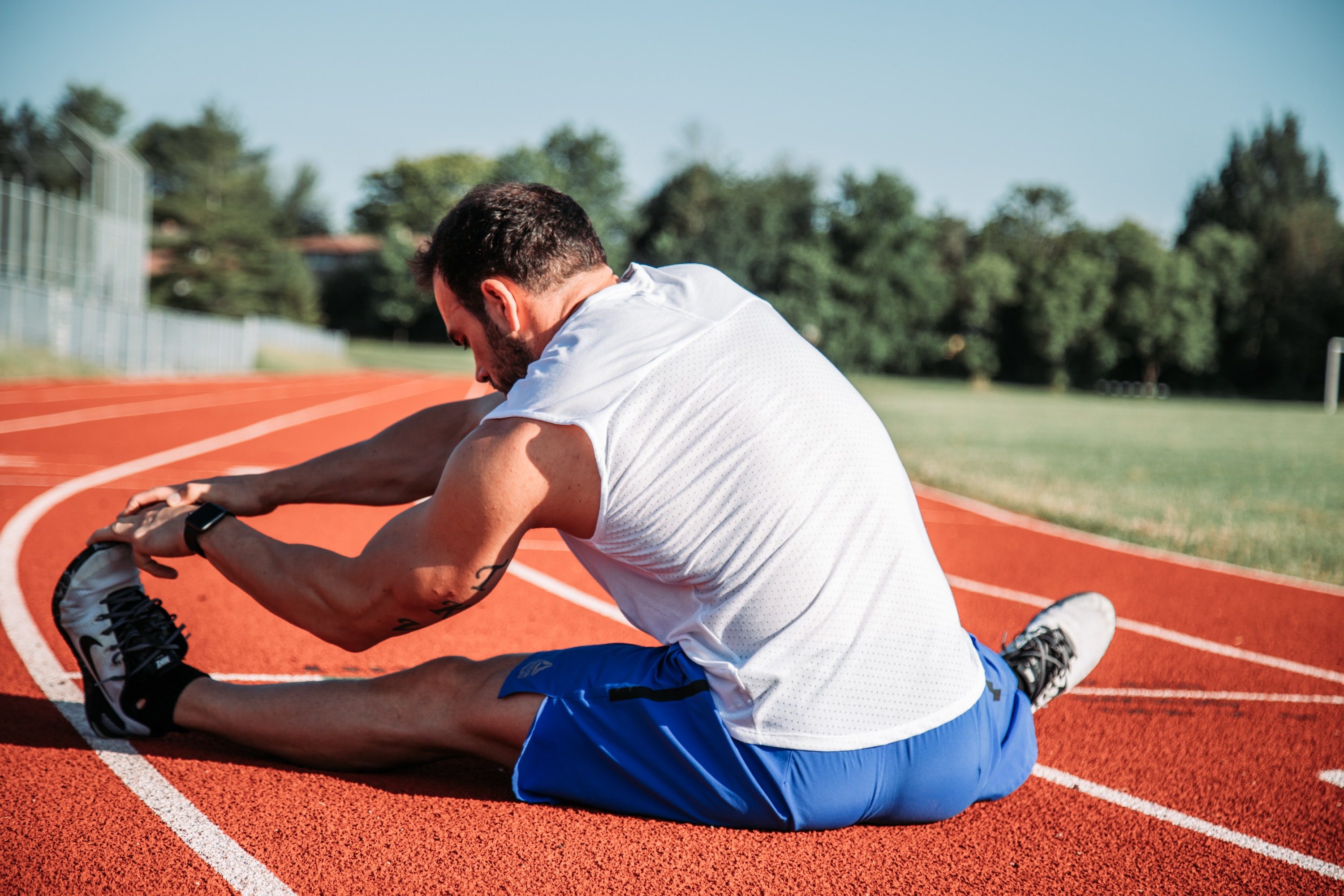 Man stretching hamstrings