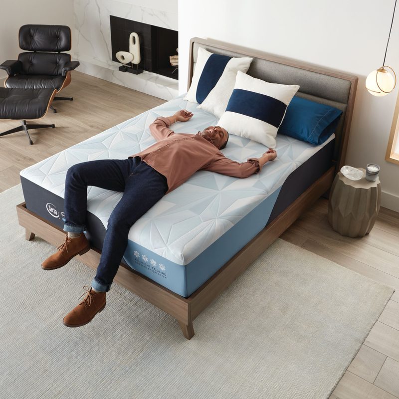 Arctic Hybrid Lifestyle Image top-down of man jumping on bed.