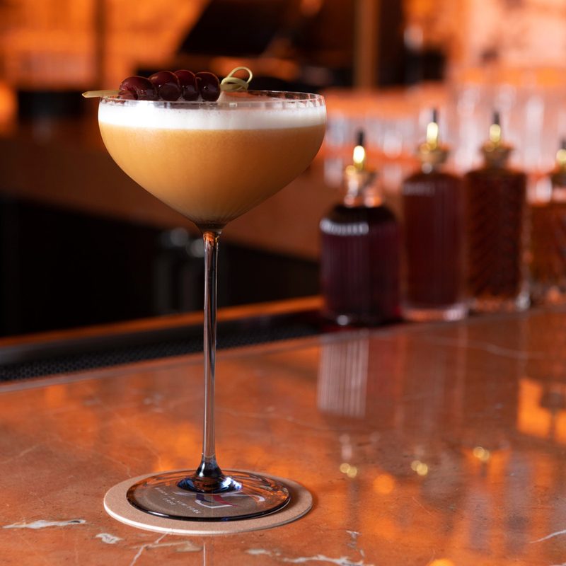 A glass of Atlantic Love cocktail in a bar.