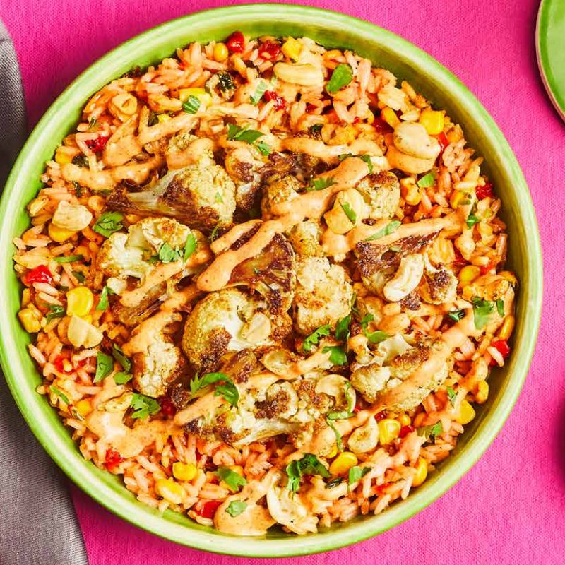 Green Chef Baja Cauliflower Bowl on pink table with fork.