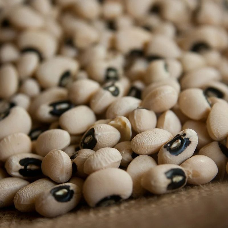 A close-up of black-eyed peas on a cloth.