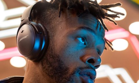 Young man wearing headphones listening to music.