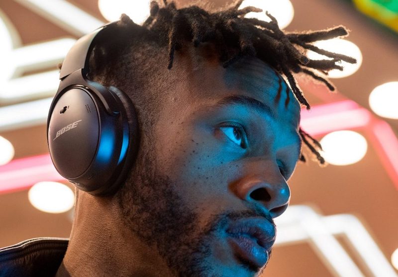 Young man wearing headphones listening to music.
