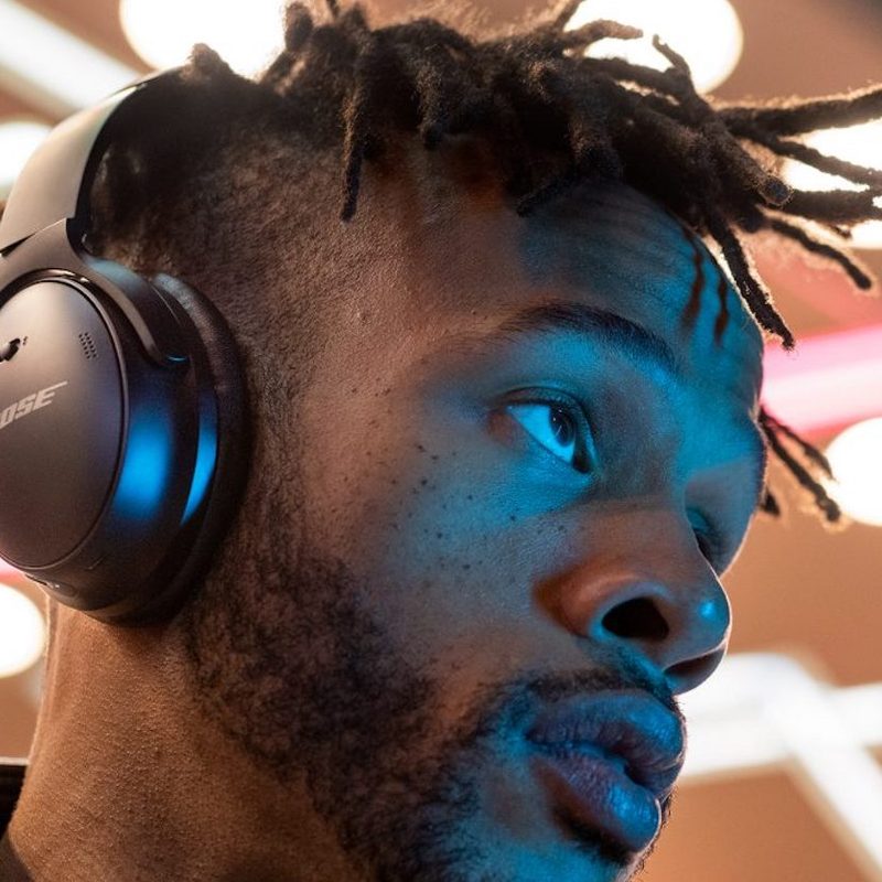Young man wearing headphones listening to music.