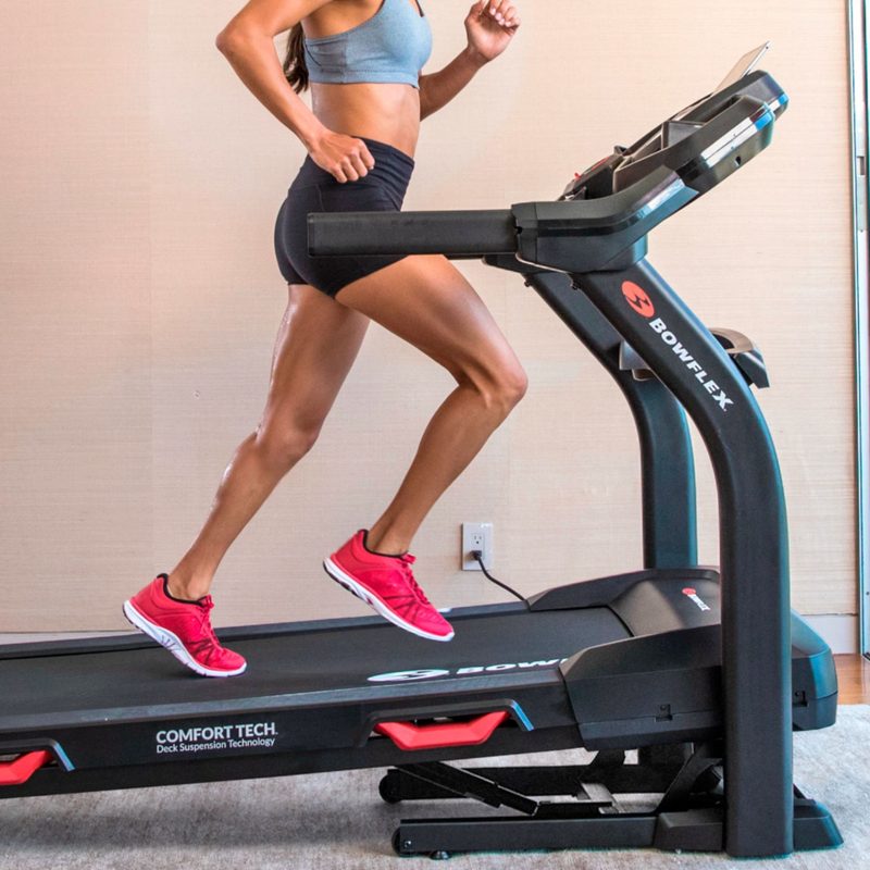 Woman running on a Bowflex BXT6 Treadmill.