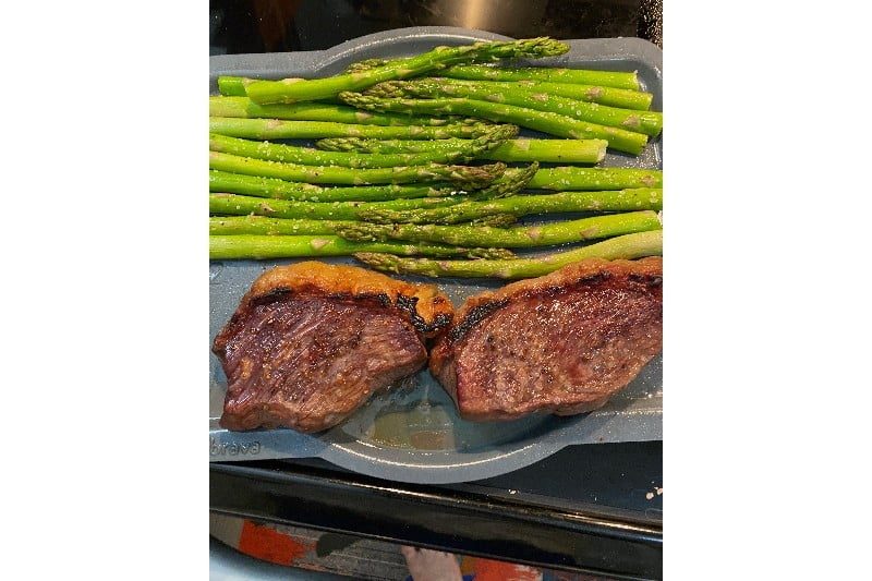Cooked steak with asparagus.
