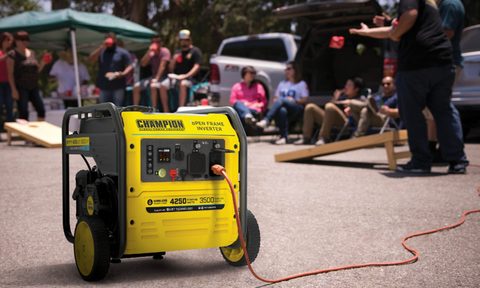 Champion Power Equipment 4250-Watt Inverter Generator in use with people playing games.