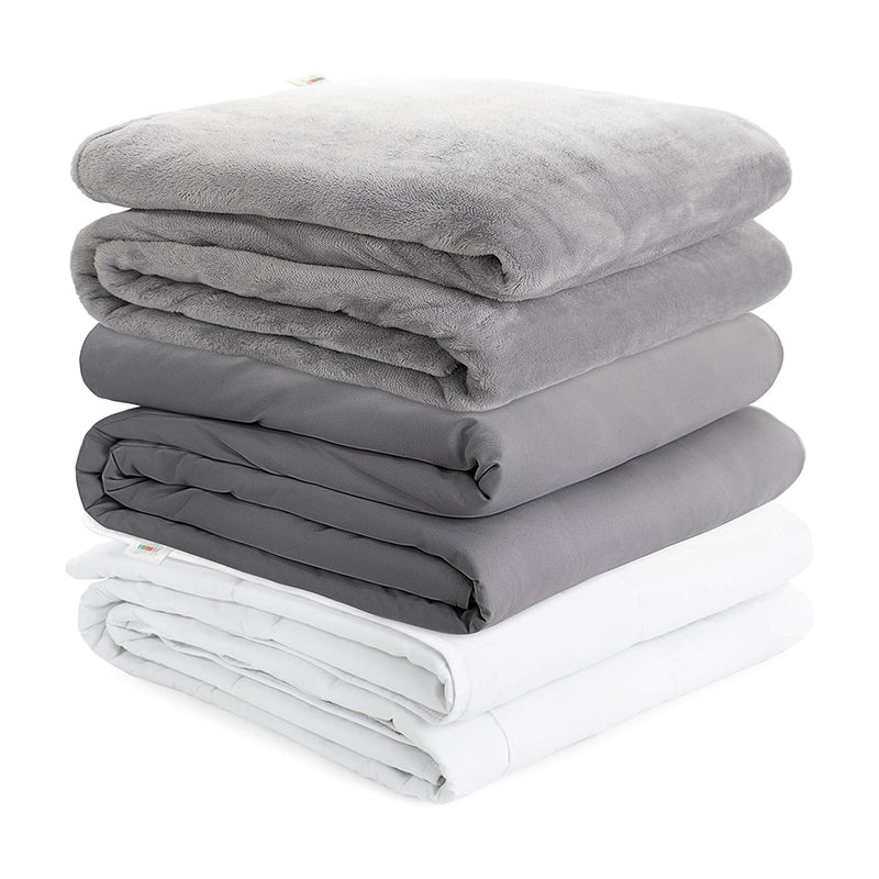 Folded Degrees of Comfort Zoning Weighted Blankets stacked on top of each other.