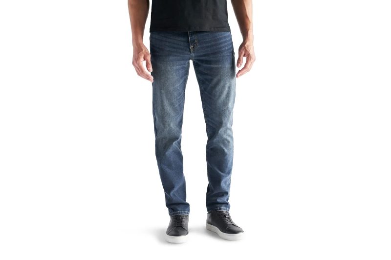 A model wearing Devil-Dog Dungarees Athletic-Fit Jeans on plain background.