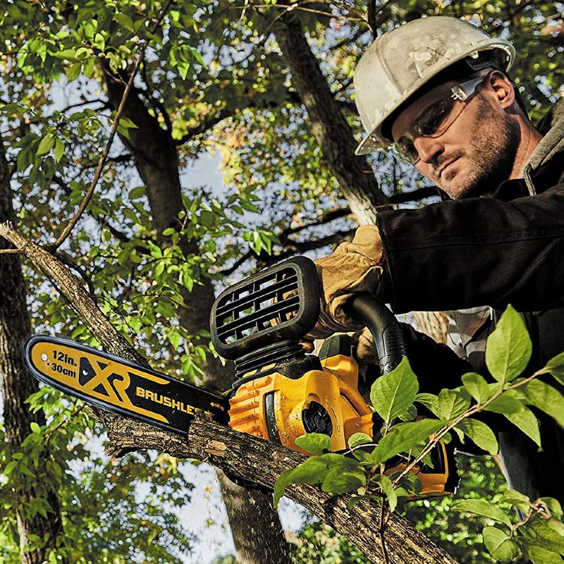 DEWALT 20V MAX XR Chainsaw trimming branches.