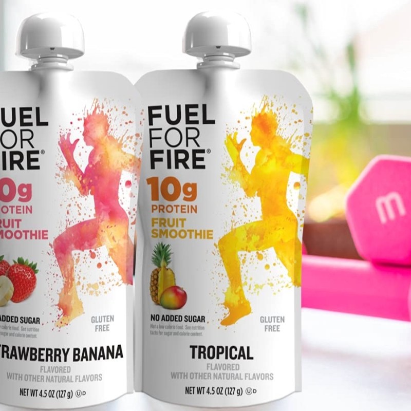 Fuel by fire smoothies standing in front of weights.