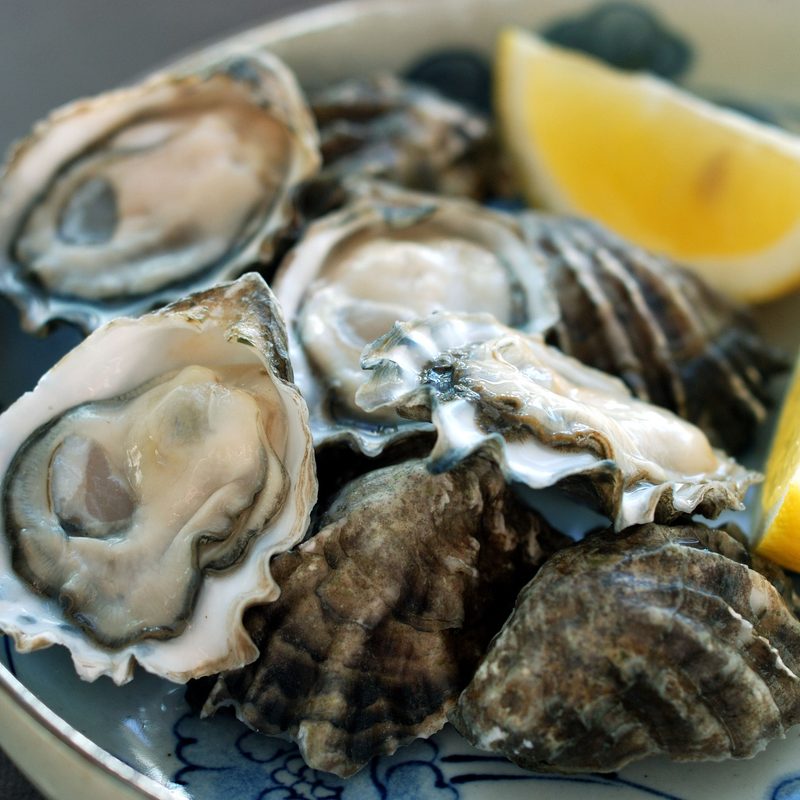 Oyster and lime in plate.