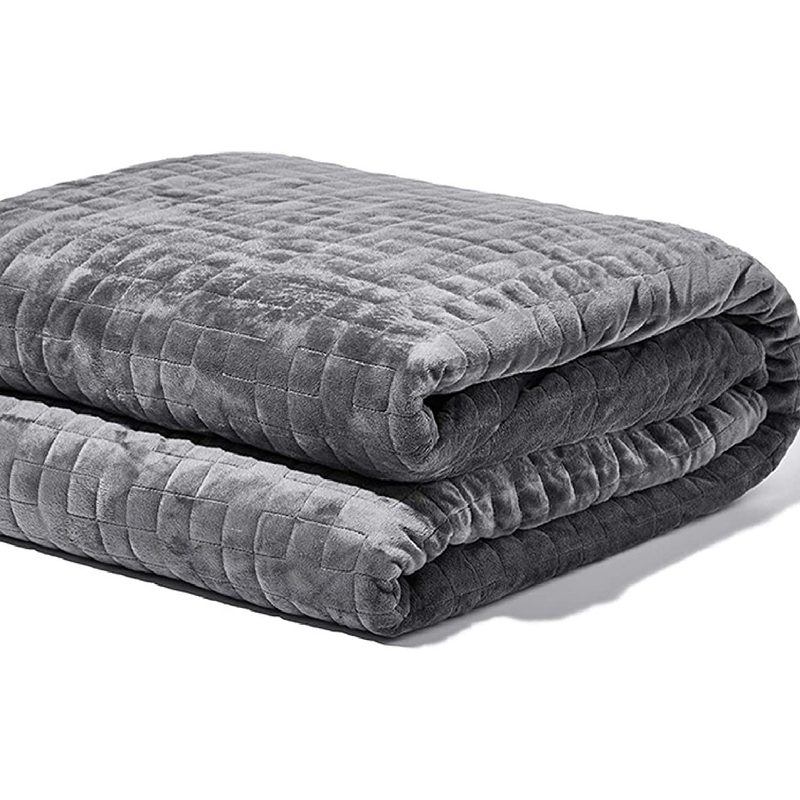 A folded Gravity Weighted Blanket on white background.