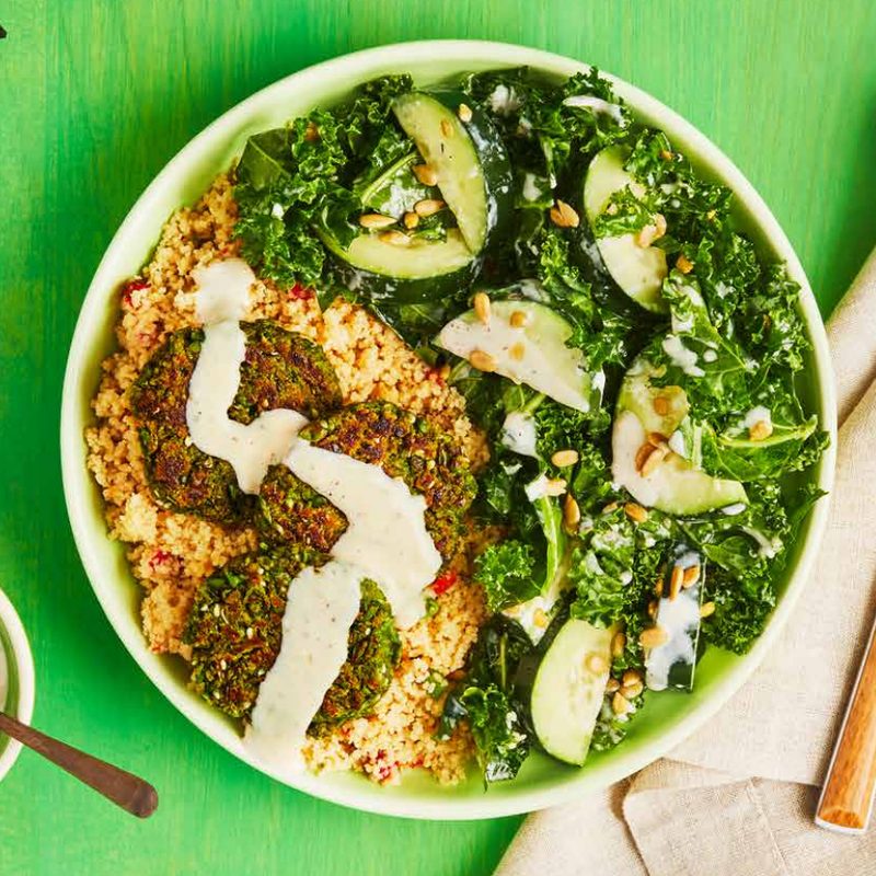 Green Chef Green Pea Falafel with Tahini on green table with fork.