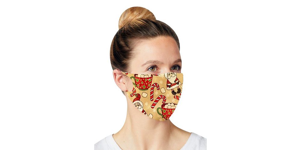 Woman wearing a Holiday Face Mask on a white background.
