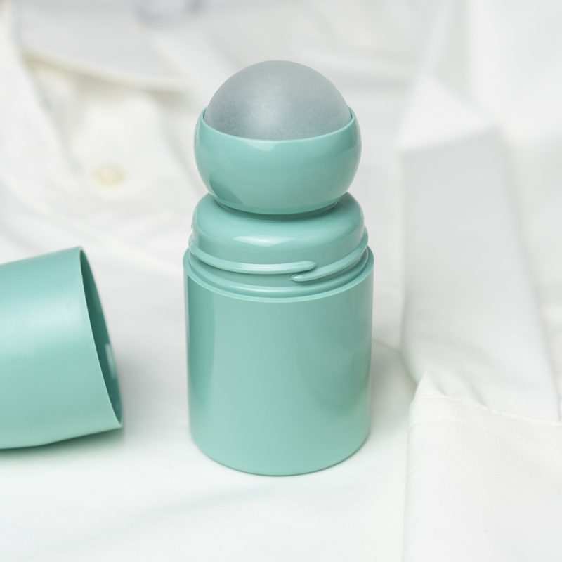 An opened deodorant stick on top of a white shirt.