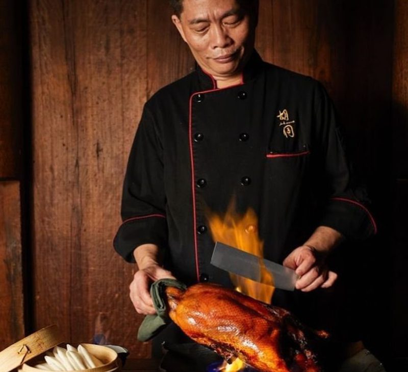 Hutong Flaming Peking Duck being prepared.