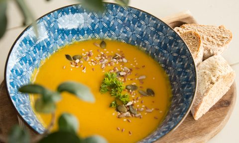 Vegan, gluten-free orange soup in a bowl.