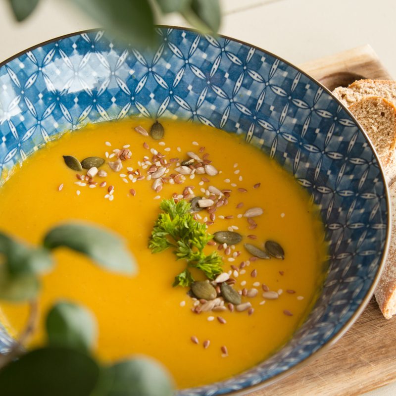 Vegan, gluten-free orange soup in a bowl.