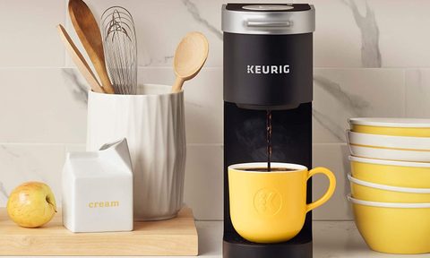 Keurig K-Mini coffee maker on a counter with accessories.