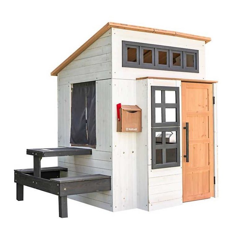 KidKraft Modern Outdoor Playhouse with wood and bench.