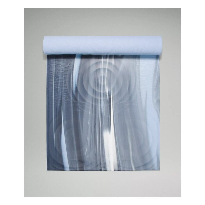Half-rolled Lululemon Take Form Yoga Mat.