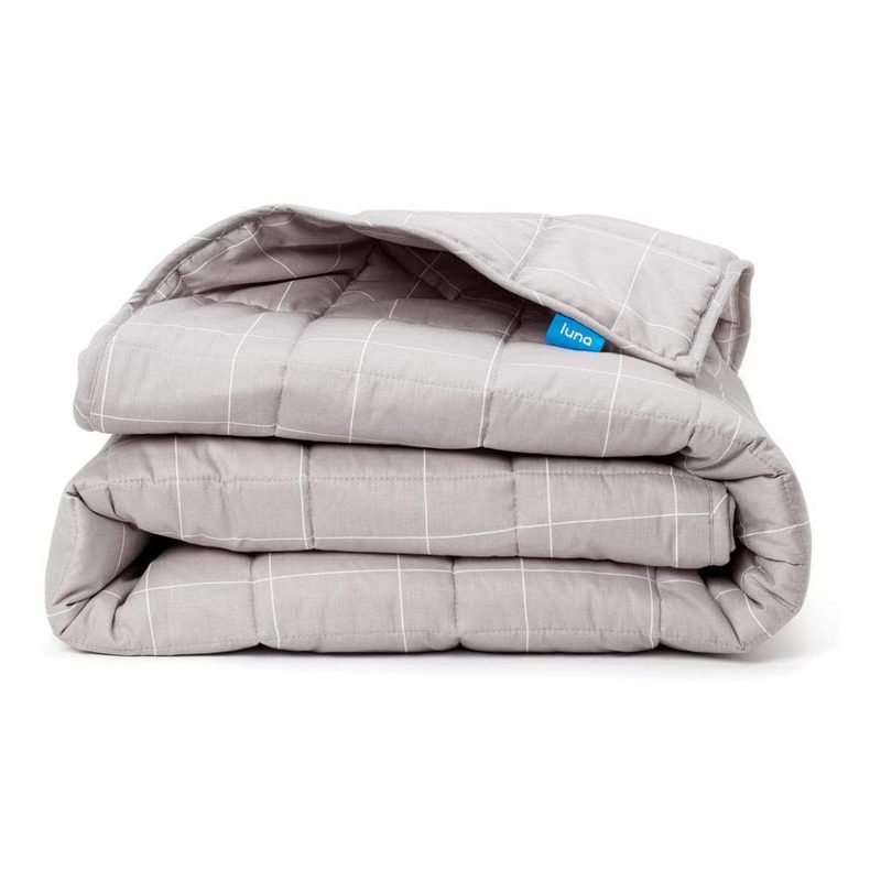 A folded Luna Adult Weighted Blanket on white background.