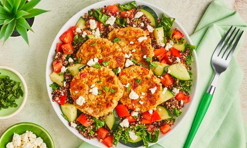 Green Chef Mediterranean Quinoa Bowl on green table with fork.