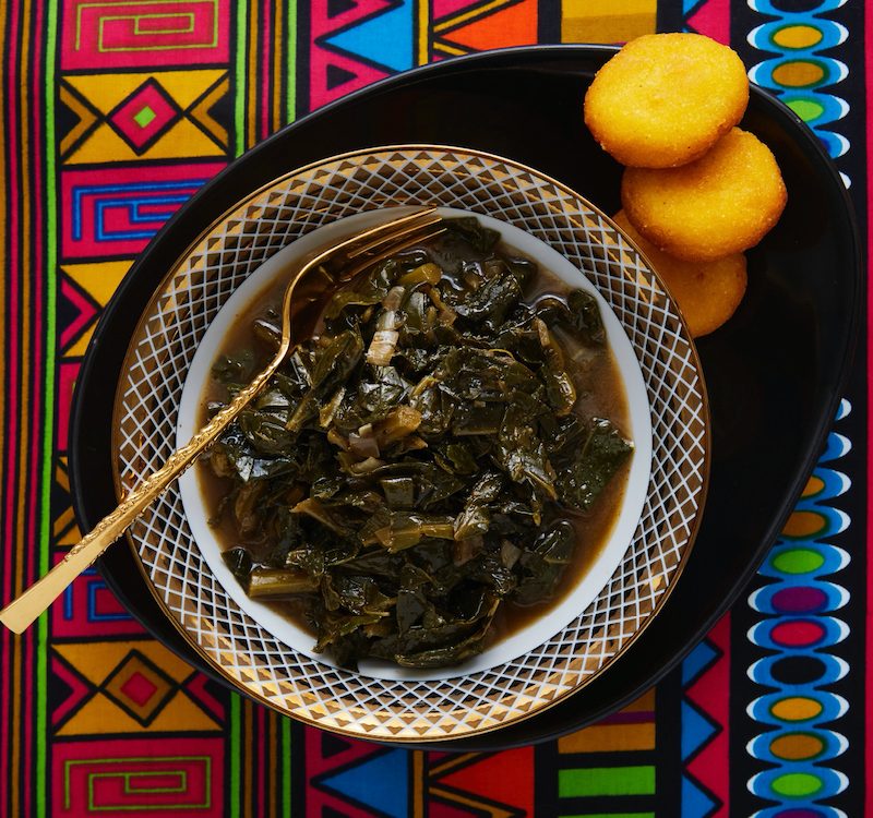 Vegan mustard greens in bowl with cornbread.