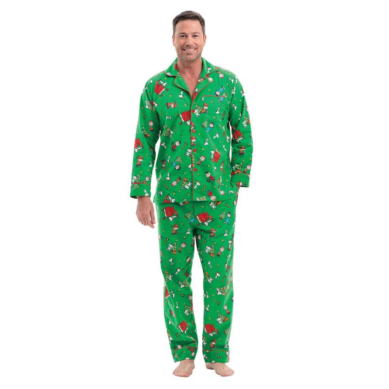 A man wearing green pajamas with Peanuts print.