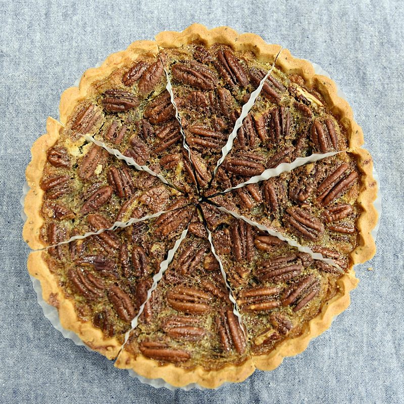 Pecan Pie on a grey textured backdrop.
