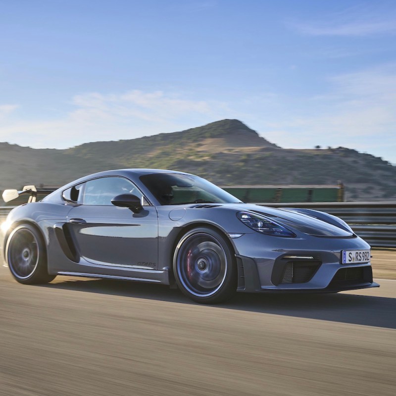 Porsche 718 Cayman GT4 RS on track front end from passenger's side.